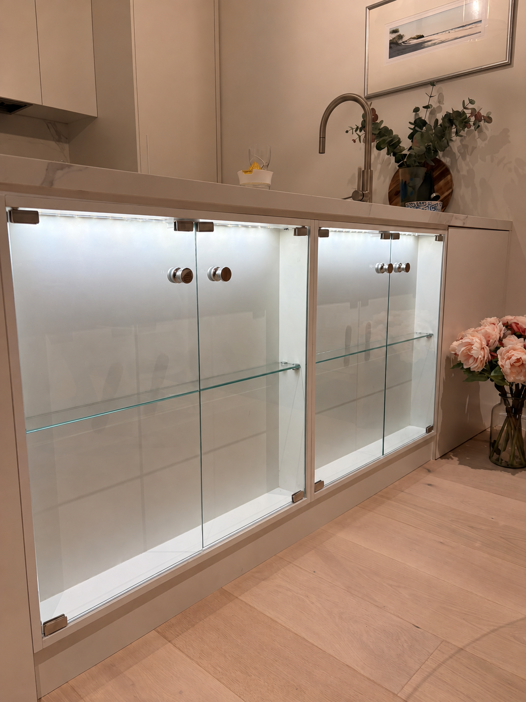 Illuminated glass display cabinet with glass shelves